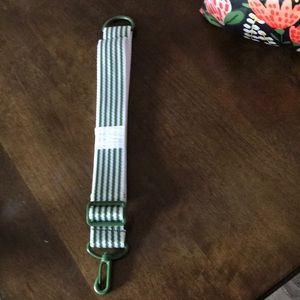 Thirty one strap , adjustable. Came with bag in third picture. Never used.